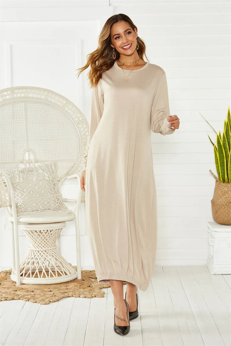 Black loose-fitting lantern dress with lace-up crew neck and ruffle detail