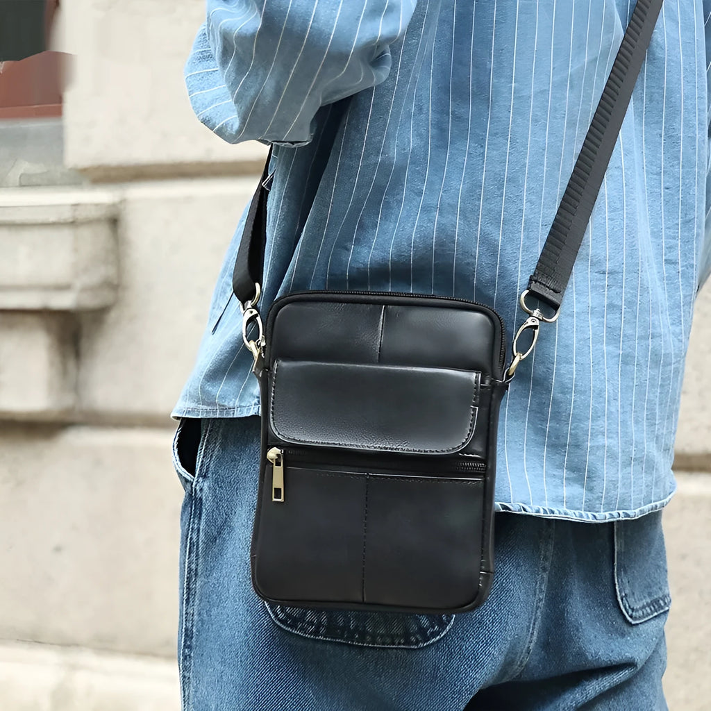 Men's brown genuine leather crossbody shoulder bag with sewing line detailing.