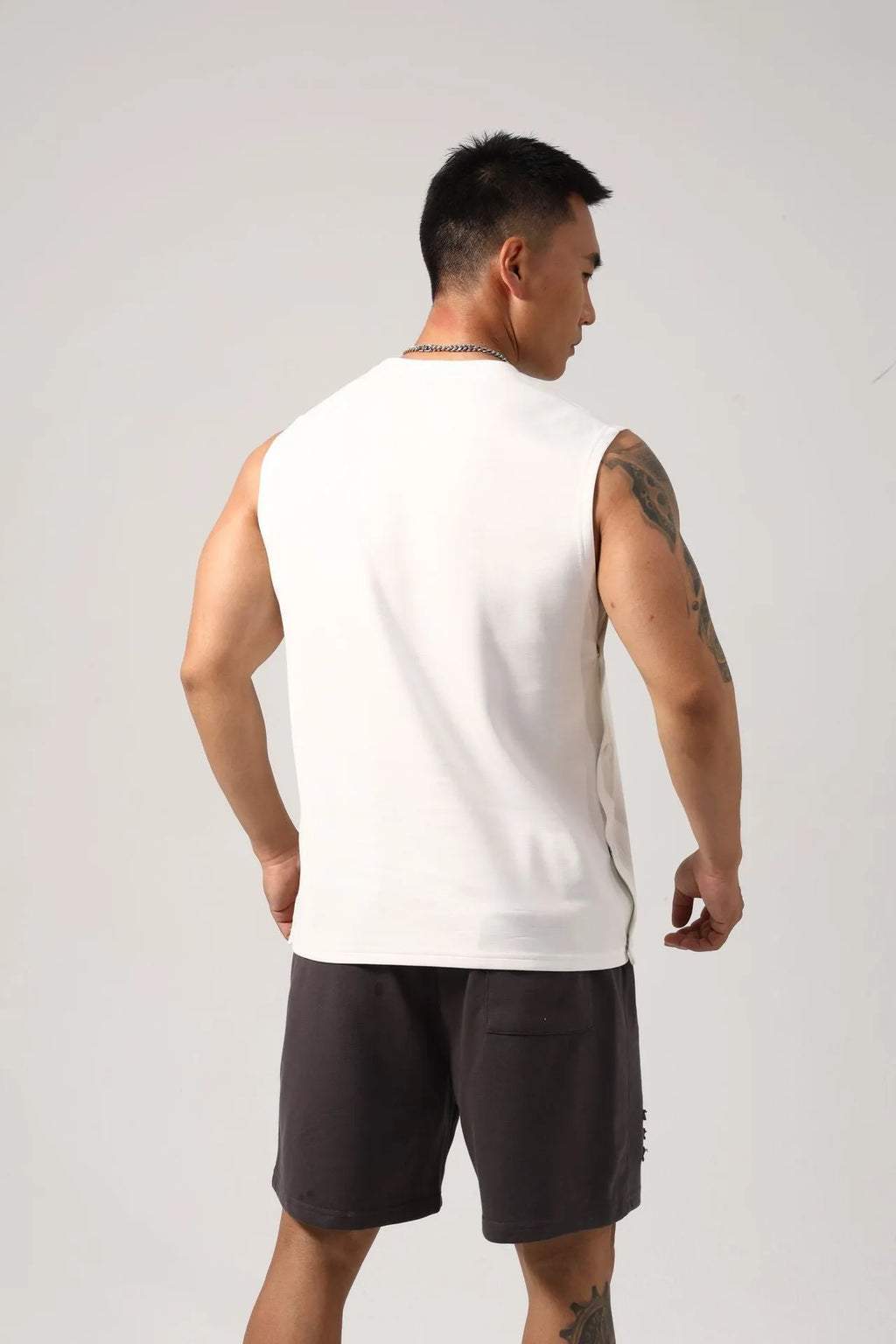 Men's black Korean style loose cotton fitness vest showing hidden hook side detail
