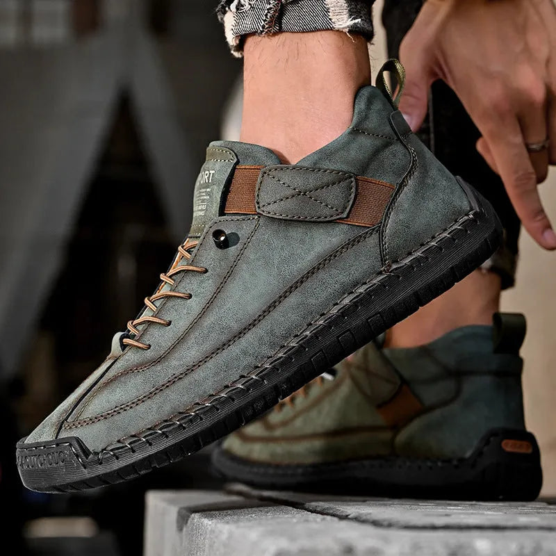 Men's mid-top Martin boot in a solid colour with elastic band, round toe, and tooling stitching on the rubber sole.