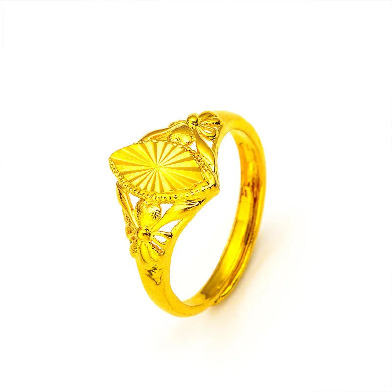 Gold coloured electroplated brass ring with open diamond flower geometry design and texture details
