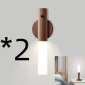 Smart sensor LED desk lamp made of solid wood and organic glass on a wooden desk
