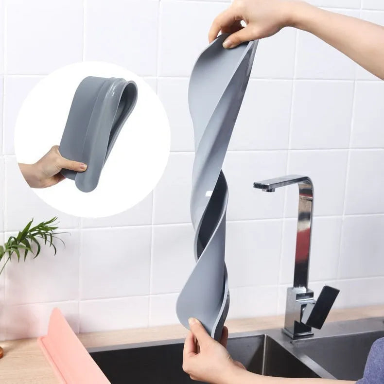Silicone kitchen sink water blocking plate splash guard in black, blue, or grey colour.