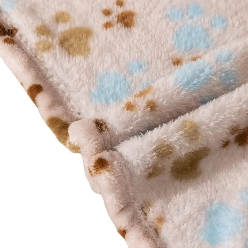 Blue dog cartoon pattern pet blanket laying flat, showing its double-sided thickened flannel texture.