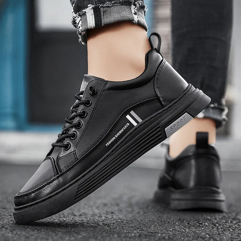 Men's low-top black and white skateboard shoes with elastic band closure and round toe.