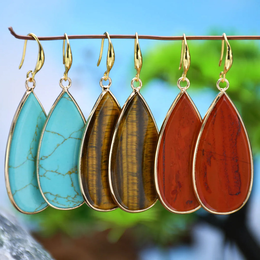 Vintage long water drop earrings in natural stone with textured surface and retro style