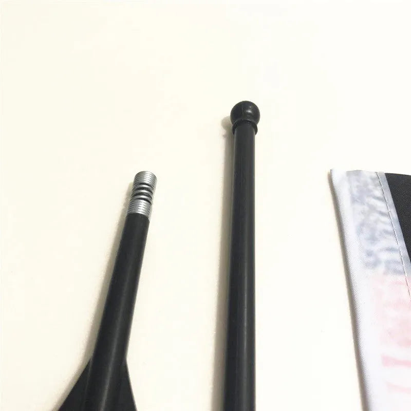 A small square polyester flag on a plastic handlebar flagpole for bicycles.
