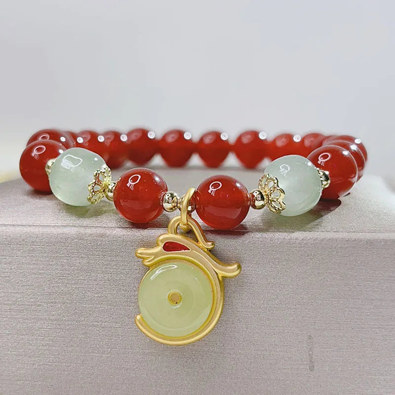 Red agate bracelet for women with Chinese style dragon motif, handmade from natural stone
